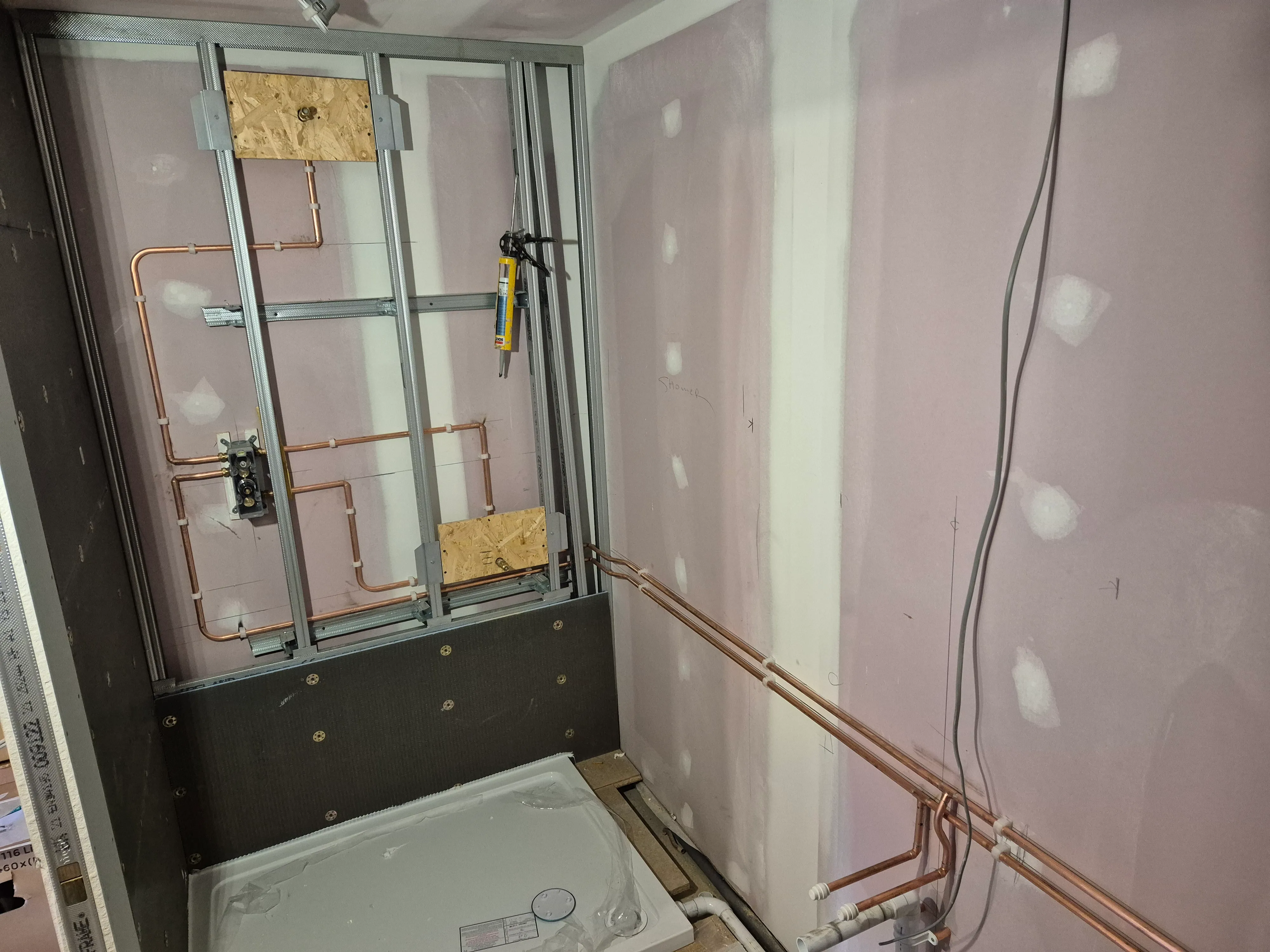 First-fix pipework — neat copper runs hidden inside the wall