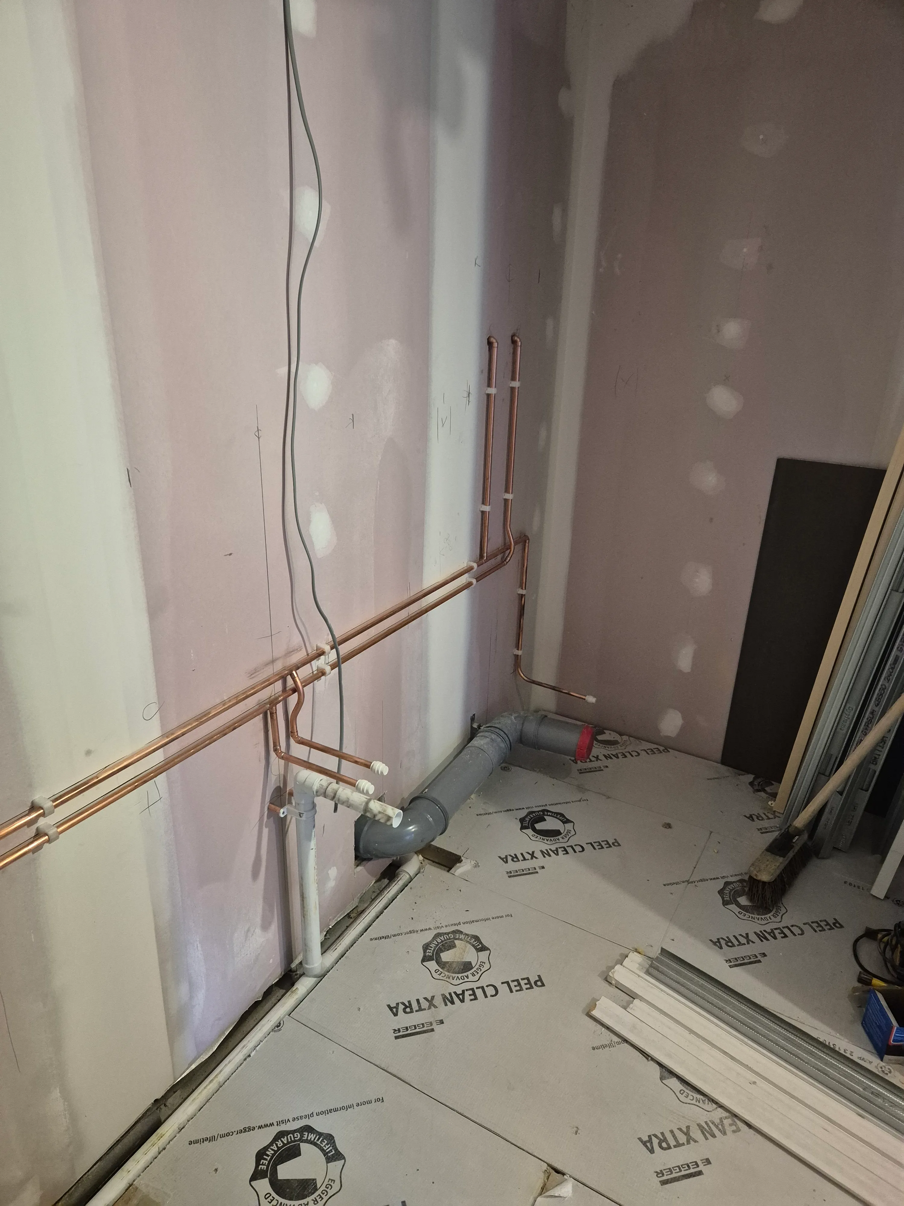 First-fix pipework ready to disappear behind the wall finish