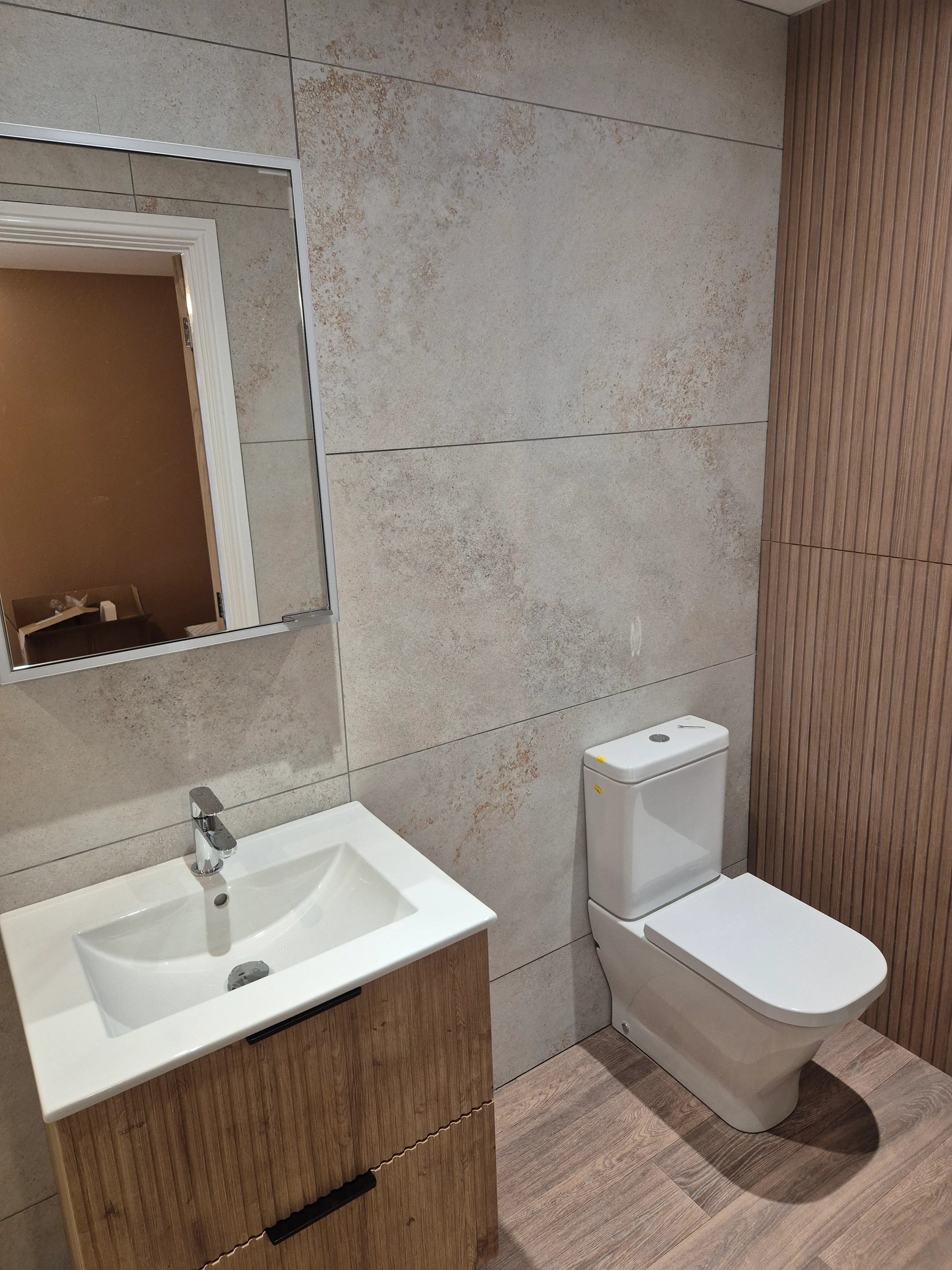 Bathroom suite — wall-hung WC, basin and tiled floor