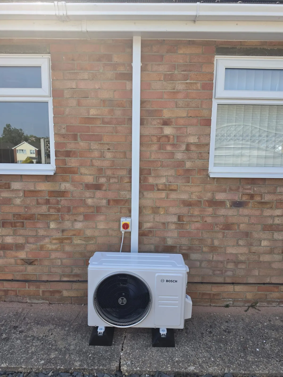 Bosch outdoor AC condenser installed on anti-vibration feet
